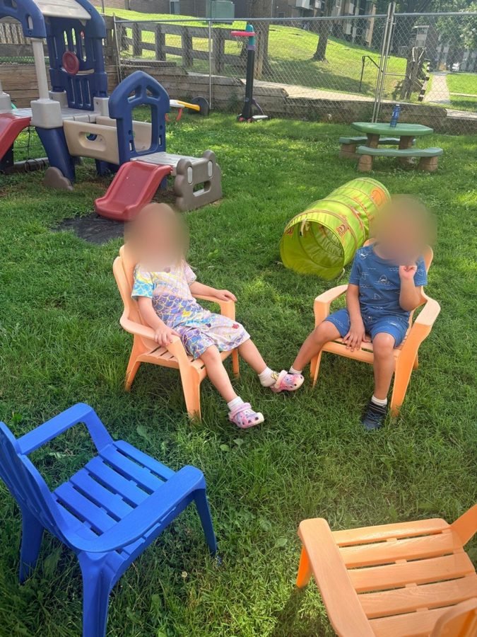 A meeting of two at EduCastle Learning Center, faces blurred for privacy