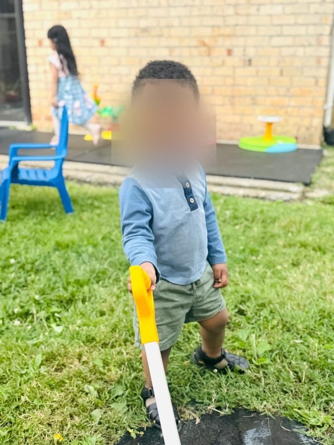 Yard work, taken seriously at EduCastle Learning Center, faces blurred for privacy